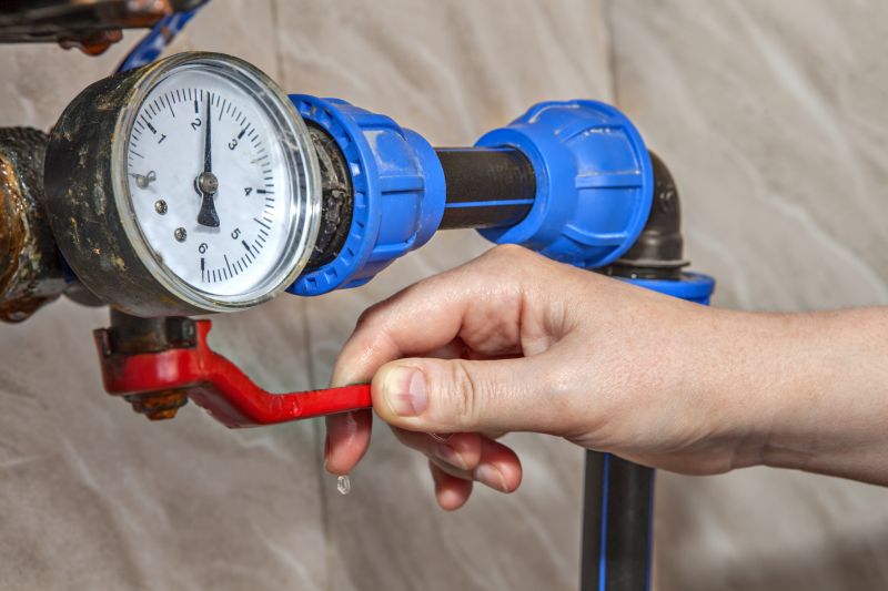 Plumber testing water pressure